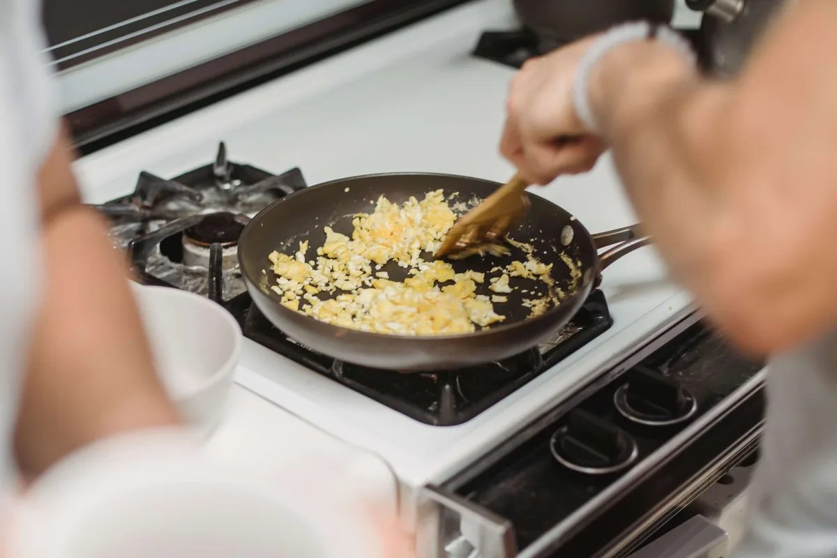 Scrambled eggs cooking in a skillet