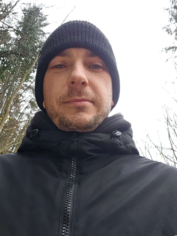 Mark Smrtnik, founder of CarnivoreTips.com, outdoors wearing a beanie and winter jacket.